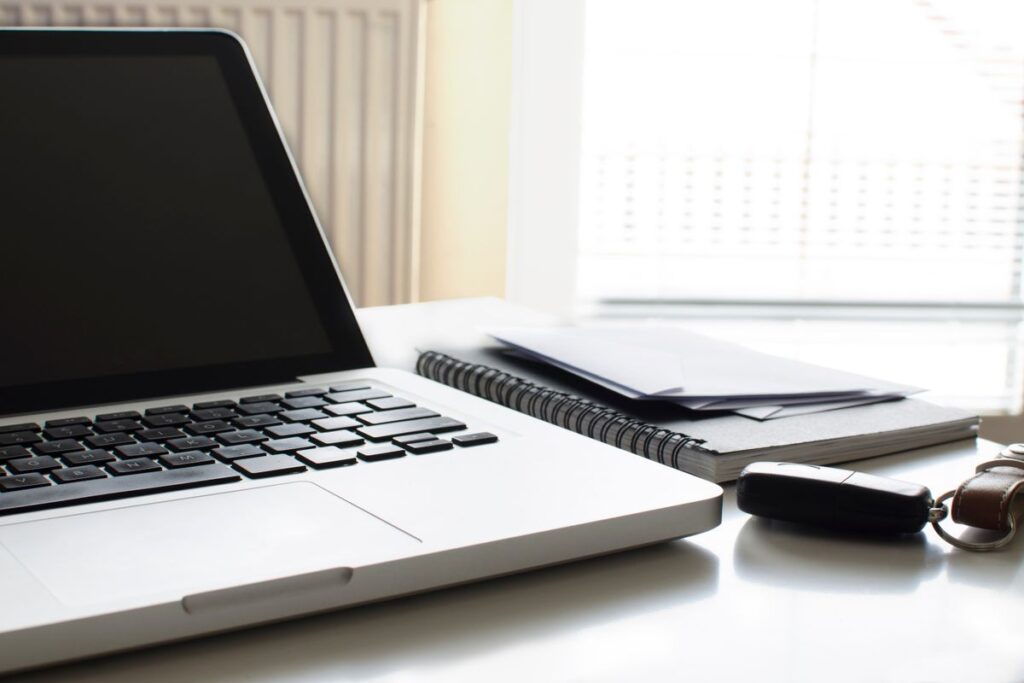 Laptop and notebook on a desk